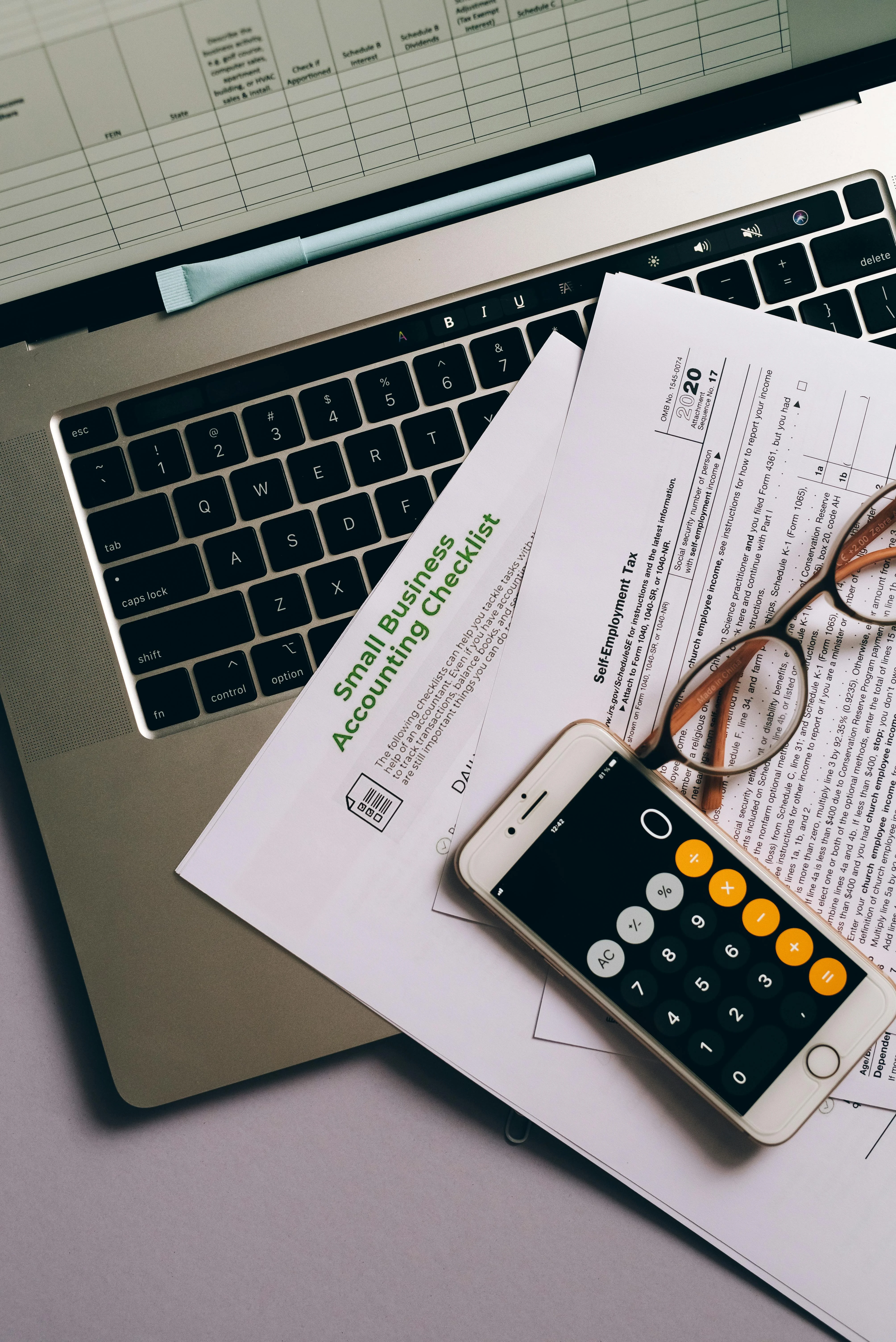 Calculator and financial documents - Professional Bookkeeping Services